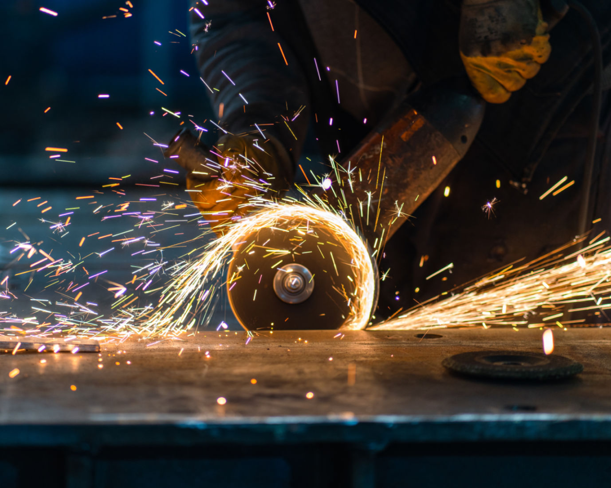 Grinding metal, bright sparks visible